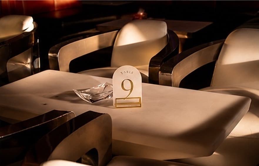 Intimate table setting with Table 9 marker and crystal ashtray