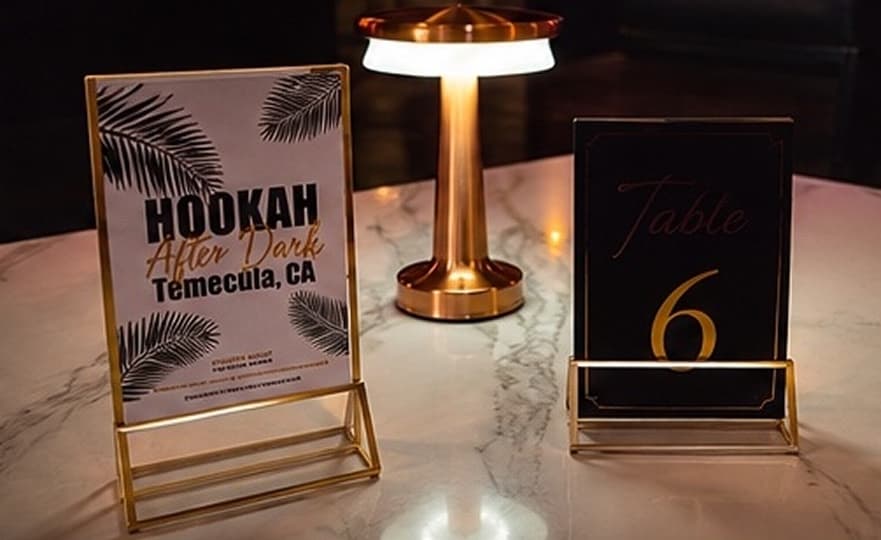 The venue's cinematic LED wall and lounge seating.